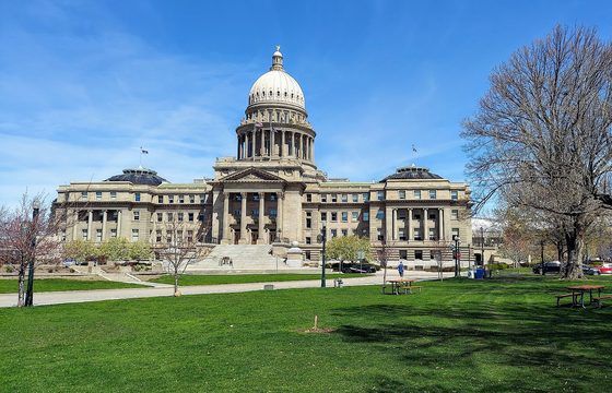 The Idaho State Capitol and its dome above the lawn in Boise