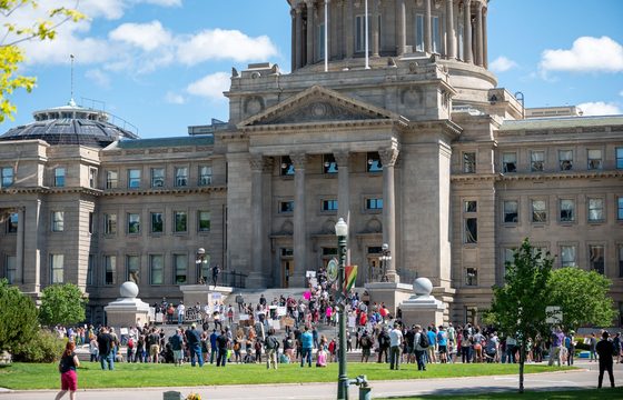 People gathered on the lawn outside the Idaho State Capitol