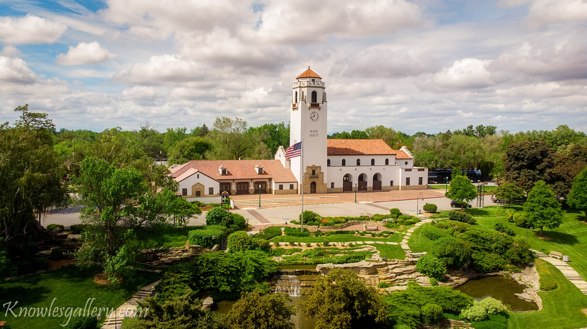 Train Depot in Boise and City park with clouds in the sky, illustrating What Is It Like to Move to Boise From Out of State