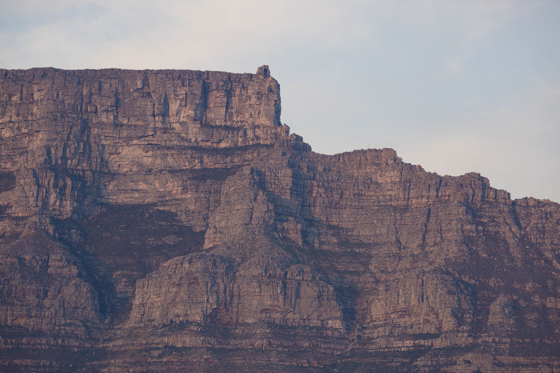 A stunning view of the majestic Table Mountain in Cape Town, South Africa, showcasing its rugged rock formations, illustrating What Is Table Rock, and What Is on Top of It