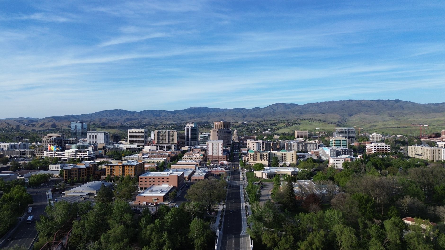 Stunning aerial capture of Boise, Idaho skyline with mountains in the background, illustrating What Is the Vista Neighbourhood in Boise, Idaho