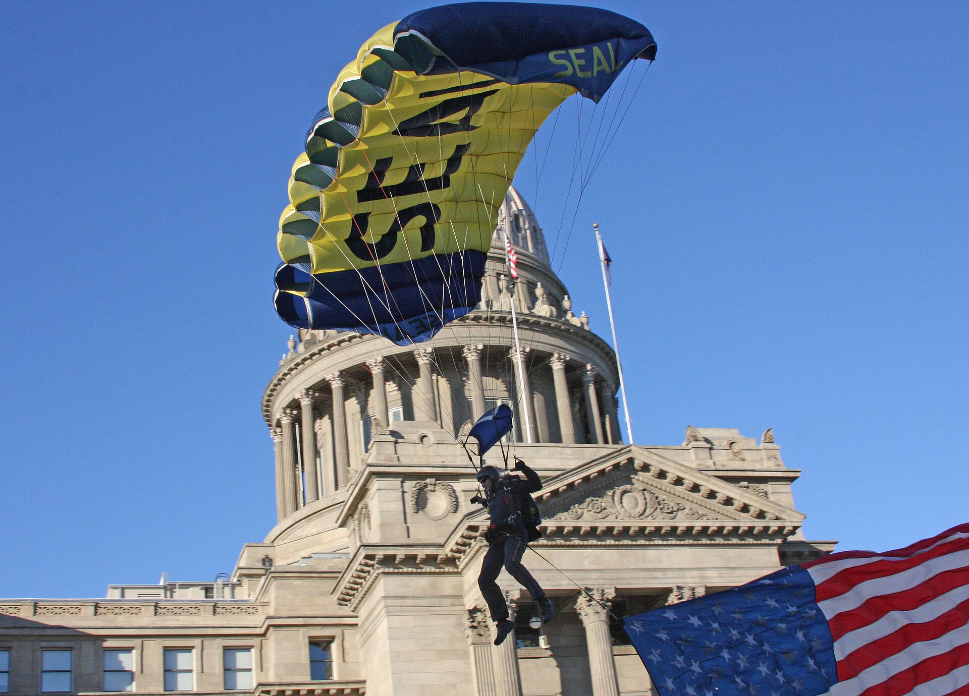 US Navy N 0000X Members of the U.S. Navy parachute demonstration team, the Leap Frogs, parachute in front of the Idaho State capitol building during Boise Navy Week, one of Navy We