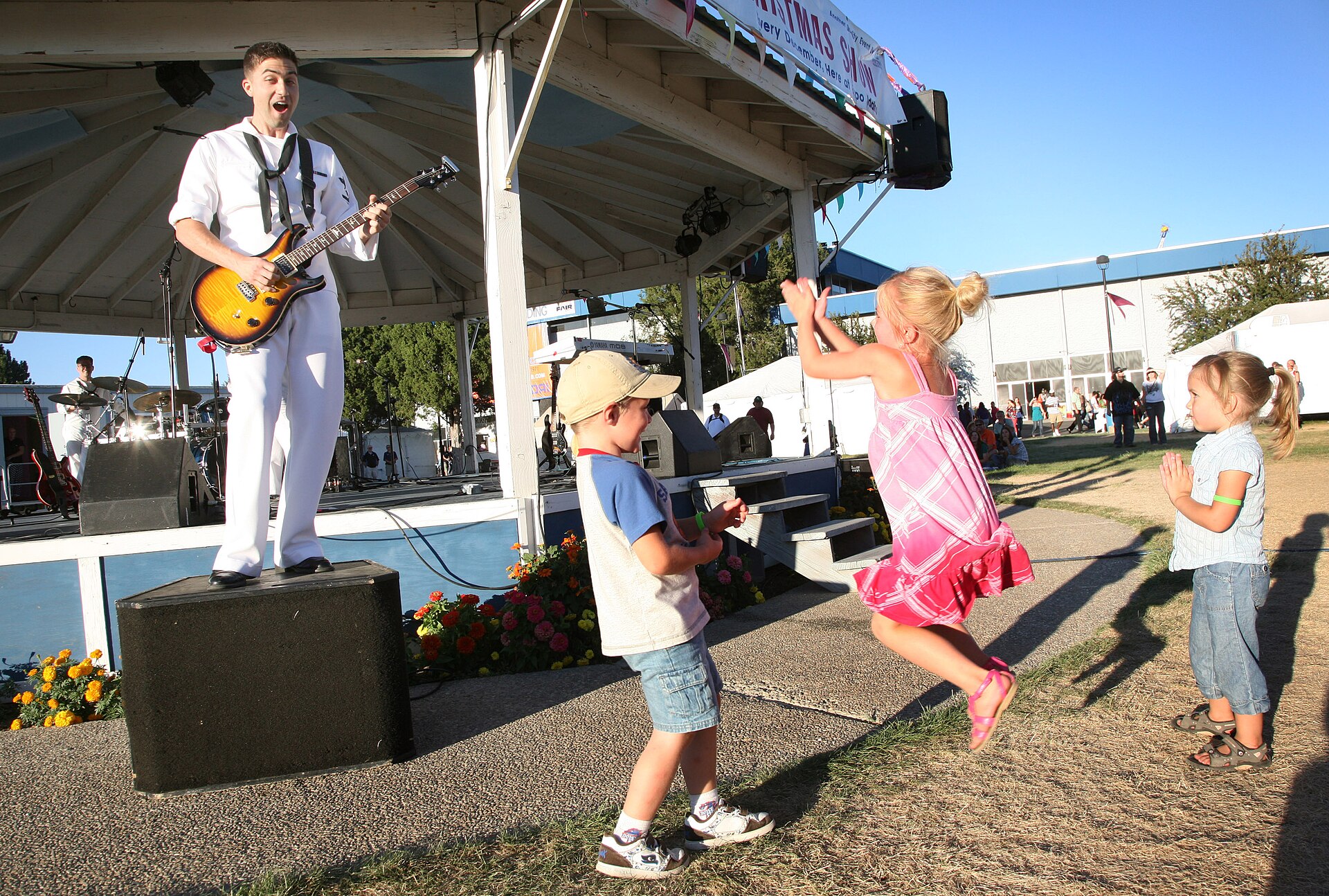 US Navy N 3271W Musician 3rd Class Clifton Murray performs with members of the U.S. Navy Band Northwest, Passage, at the Western Idaho Fair during Boise Navy Week, illustrating Wha