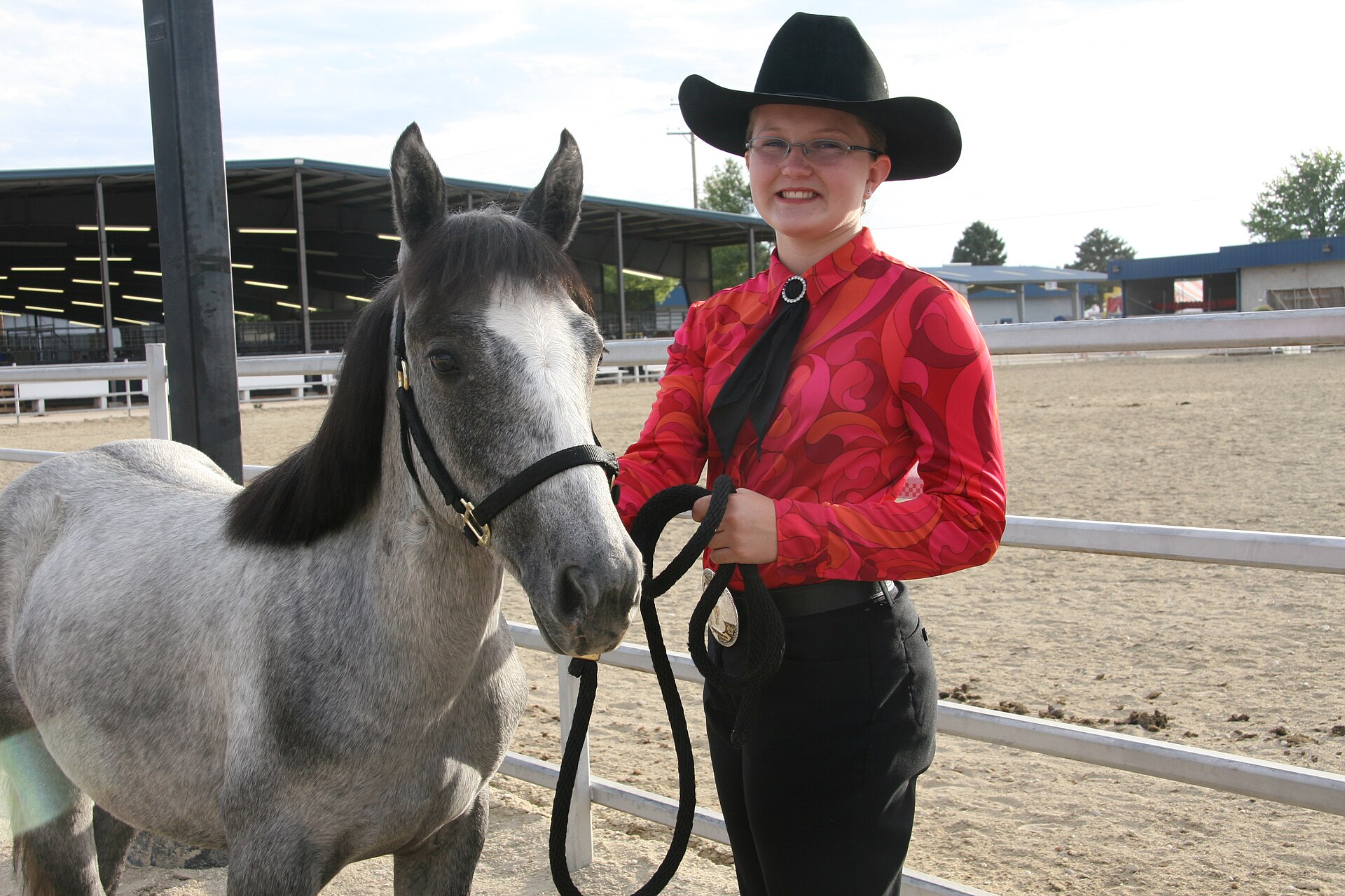 4 H youth pose for photos prior to the mustang only in hand trail class competition at the Western Idaho State Fair in Boise, illustrating What Is the Western Idaho Fair? A Straigh