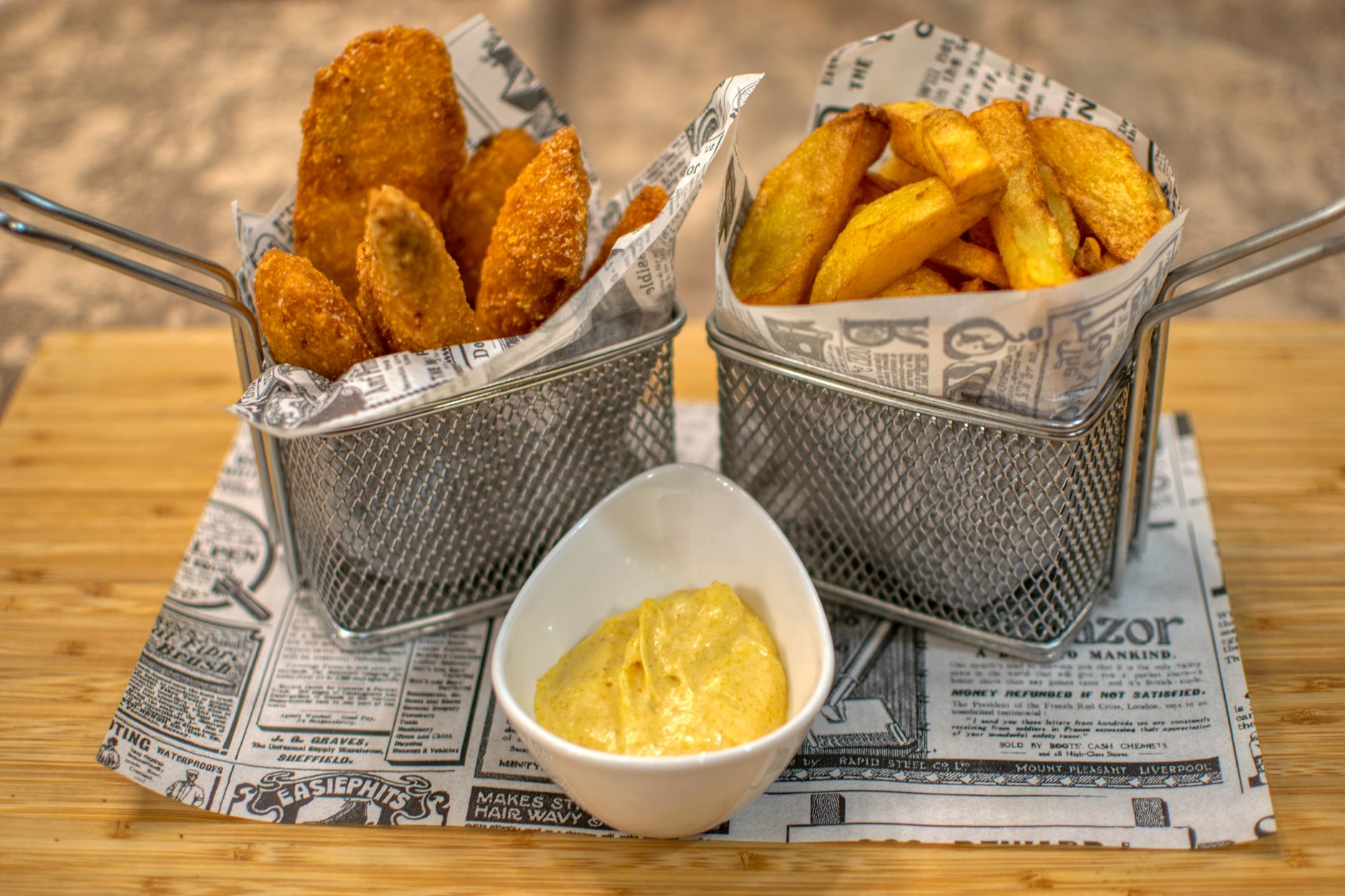 Delicious crispy chicken tenders served with fries and dipping sauce in a restaurant setting